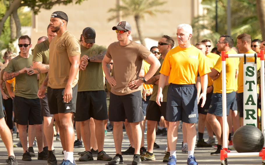 Vice Adm. James Malloy, right, U.S. 5th Fleet Commander, prepares for a 5K run during a memorial event for the USS Firebolt at Naval Support Activity Bahrain on April 24, 2019. 

