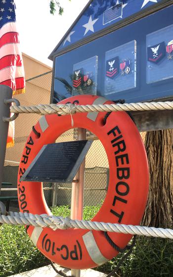 A memorial honors three fallen servicemembers during a memorial ceremony for the USS Firebolt at Naval Support Activity Bahrain on April 24, 2019. 

