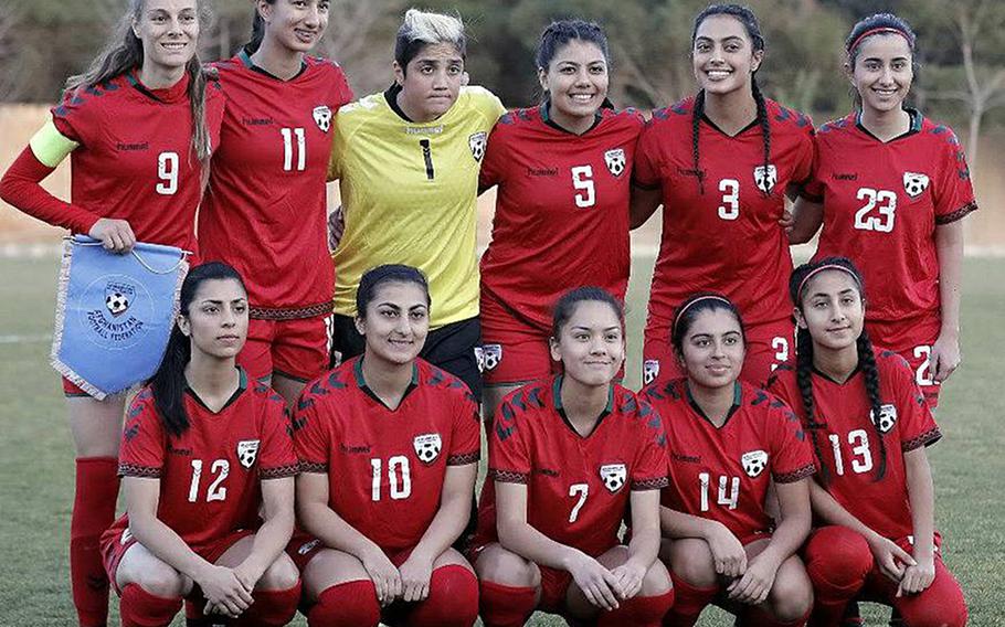 Members of the Afghan women's soccer team pose in a photo taken prior to accusations of widespread sexual assault by male officials against women athletes. Former team captain Shabnam Mobarez, No. 9, top left, told Stars and Stripes she had quit the team after hearing the allegations rather than sign a contract she said prohibited her from speaking out.

