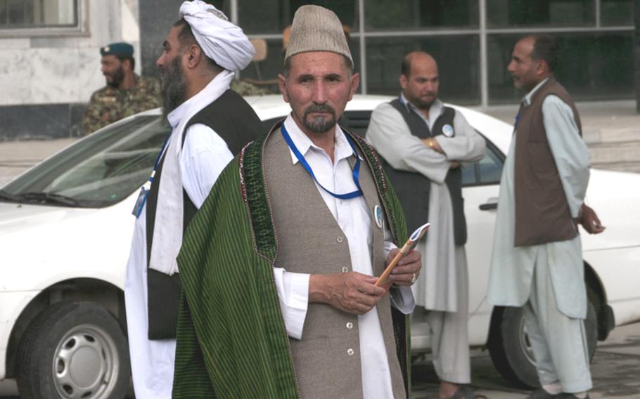 Delegates milled outside of he Kabul Polytechnic University following the second day of a peace jirga aimed at ending the war in Afghanistan. The conference, or jirga, was expected to issue its nonbinding recommendations Friday.