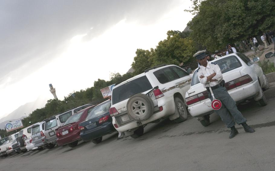 Security remained highly visible during the second day of a peace conference in Kabul, a day after a trio of Taliban fighters attacked the assembly with rockets and automatic weapons. Two of the attackers were killed but none of the delegates to the conference were injured, the government said.