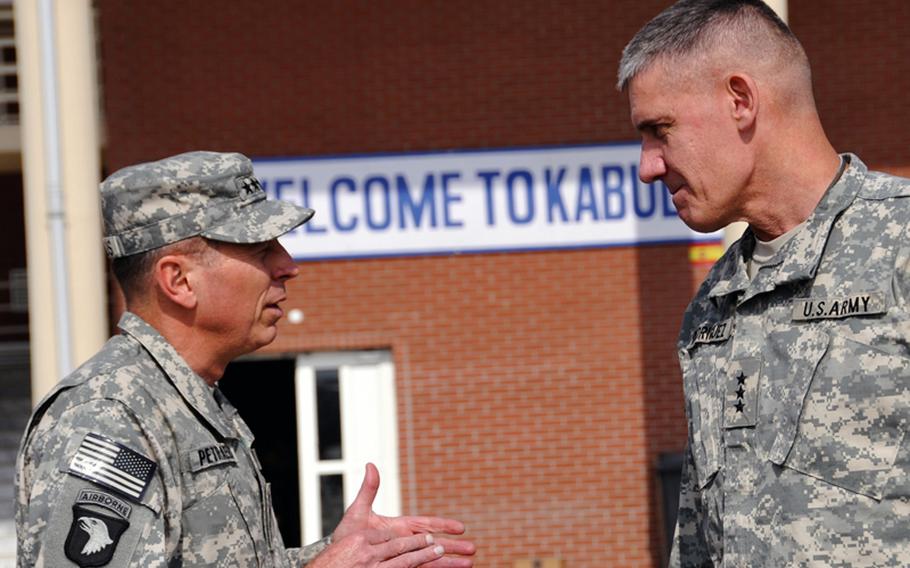 U.S. Army Gen. David H. Petraeus, left, commander, U.S. Central Command, speaks with Lt. Gen. David Rodriguez, deputy commander of U.S. Forces Afghanistan, at Kabul International Airport, Afghanistan, Oct. 30, 2009.