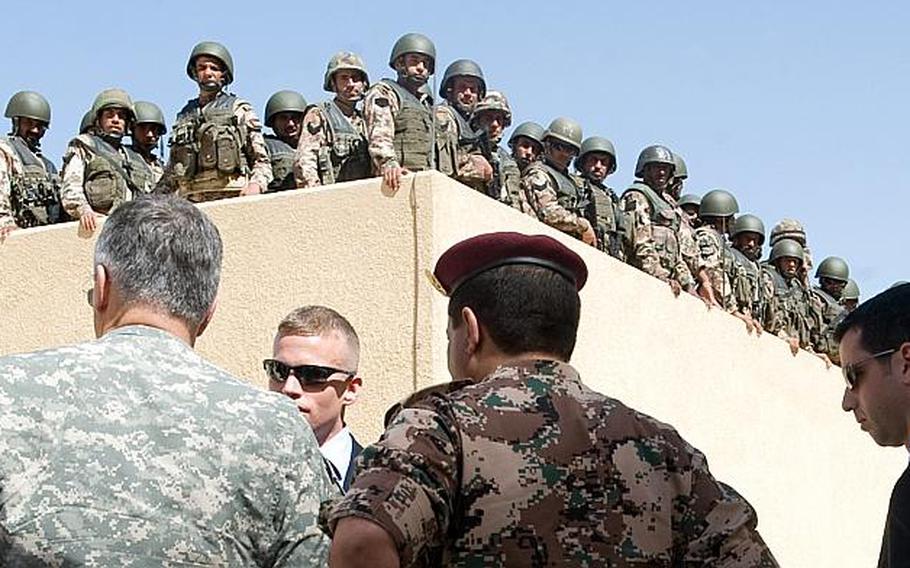 Jordanian soldiers wait to begin training, while Chief of Staff of the U.S. Army Gen. George W. Casey Jr. is given a briefing on the facilities at the Special Operations Training Center near Amman, Jordan.