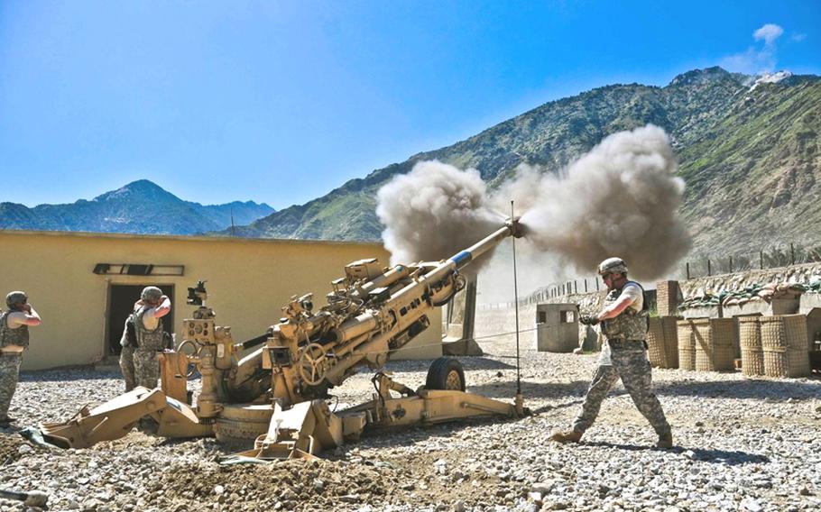 Soldiers with Bravo Battery, 3rd Battalion, 321st Field Artillery Regiment fire a howitzer on May 24 from FOB Blessing, Afghanistan. The gun was destroyed during a fight with insurgents on June 4.