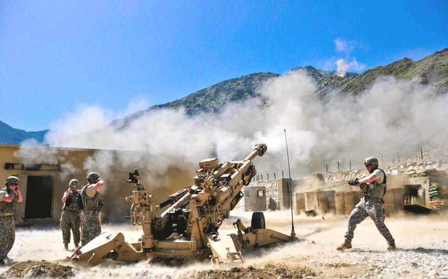 Soldiers with Bravo Battery, 3rd Battalion, 321st Field Artillery Regiment fire a howitzer on May 24th from FOB Blessing, Afghanistan. The gun was destroyed during a fight with insurgents on June 4.