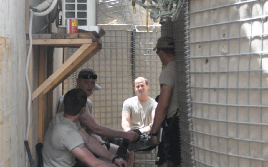 Soldiers relax on July 19 in a protected maze of tunnels in the frequently attacked COP Michigan in the Pech River Valley in Kunar province.