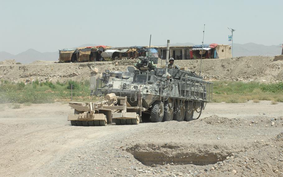 Soldiers with the 2nd Stryker Cavalry Regiment patrol in Kandahar province.