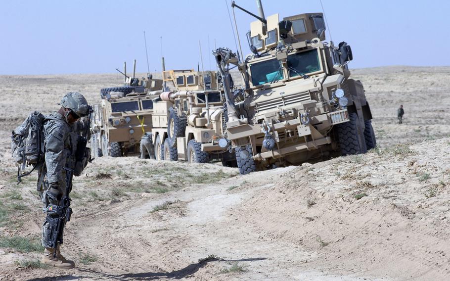 Members of the 2nd Stryker Cavalry Regiment Engineer Troop, including Cpl. Brandon Turner, 23, of Fort Pierce, Fla., left, drove for three hours last week across a desolate plain to reach Helal China, a village in Zabul province's Shah Joy district.