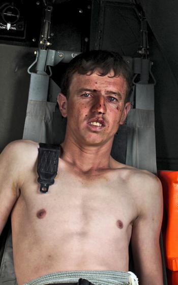 A man sits in a helicopter