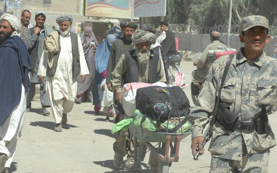 People cross from Spin Boldak district, Afghanistan into Pakistan on Sept. 22.