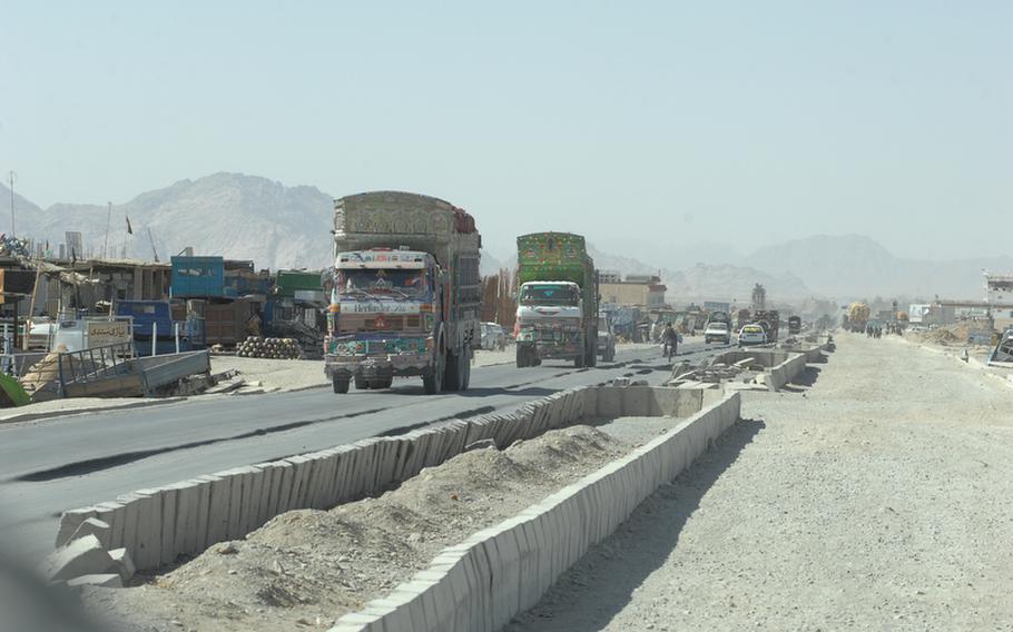 Trucks approach the border with Pakistan in Spin Boldak district, Afghanistan on Sept. 22. U.S. soldiers there suspect large amounts of bomb making chemicals are being smuggled into the country amongst other imports.