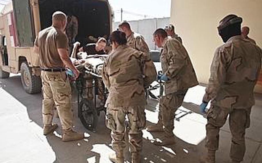 The next day, Pfc. Kevin Macari, wounded by a Taliban bomb blast is brought into Kandahar Air Field's Role 3 hospital. Macari lost a foot in the blast. 