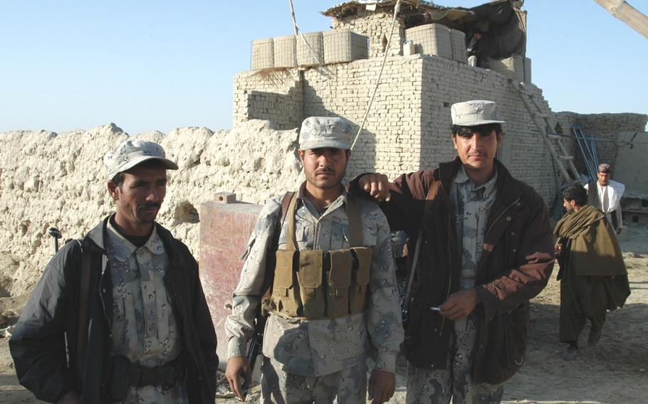 Members of the Afghan Border Police pose in front of a roadside checkpoint near Spin Boldak in Kandahar province. U.S. Army units recently visited checkpoints throughout the area seeing what the ABP officers need to get through the upcoming winter, but did so on the condition that the local police keep better tabs on any clothes and other equipment that is handed out.