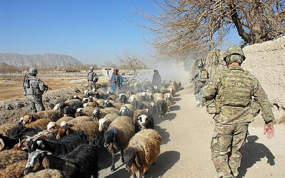 Maj. Gen. James Terry, commander of troops in southern Afghanistan, visits the village of Malajat, just south of Kandahar City in January. Asked what he thought of the area’s progress toward stable security, he said “I think we’ll know more in July.” The military says although signs look promising it can’t yet judge the success of clearing campaigns across Kandahar. Not until the fighting season begins again this spring will they start to have answers. The lieutenant colonel showing Terry around commented that in the summer the area is beautiful — deadly — but beautiful. “Hopefully not this summer,” Terry replied.