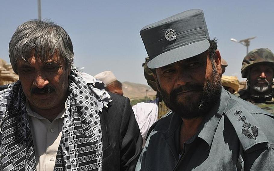 Atiqullah Lodin, left, governor of Logar province, and Ghulam Sakhi, Logar's police chief, attend a shura in the southern district of Kherwar in early May.

Martin Kuz/Stars and Stripes