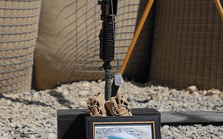 Photograph of Sgt. Aaron Smith at a memorial service for him and Private 1st Class Brandon Owens, who were killed Oct. 2, 2009 by an Afghan police officer known to Americans as Crazy Joe.
