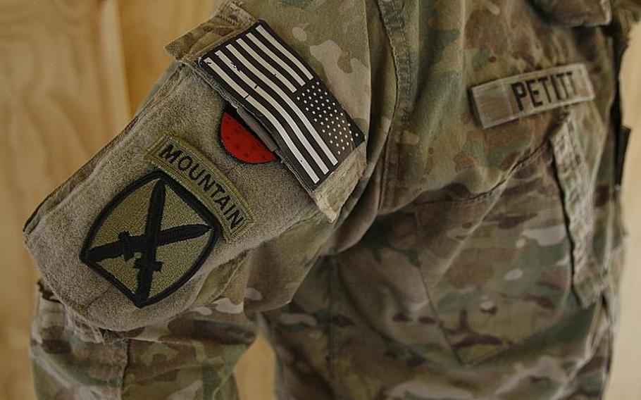 Staff Sgt. Bruce Petitt, 3rd Brigade Combat Team, 10th Mountain Division, wears his tourniquet with the pull tab exposed on June 26, 2011, at Forward Operating Base Pasab, Afghanistan. A new policy within the division requires all soldiers to wear tourniquets on their right shoulder with the pull-tab exposed.
