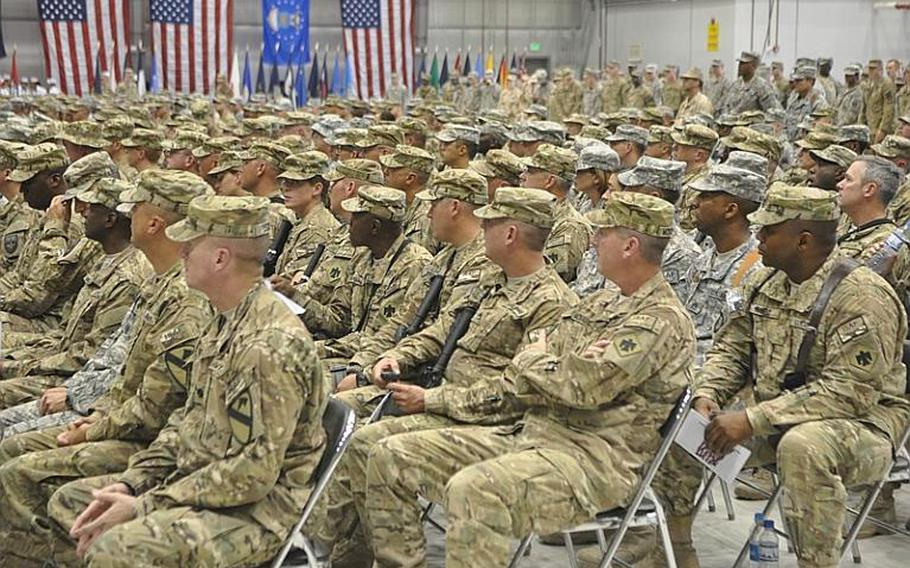 Soldiers listen to Gen. David Petraeus during a re-enlistment ceremony at Bagram Airfield in eastern Afghanistan on Independence Day.