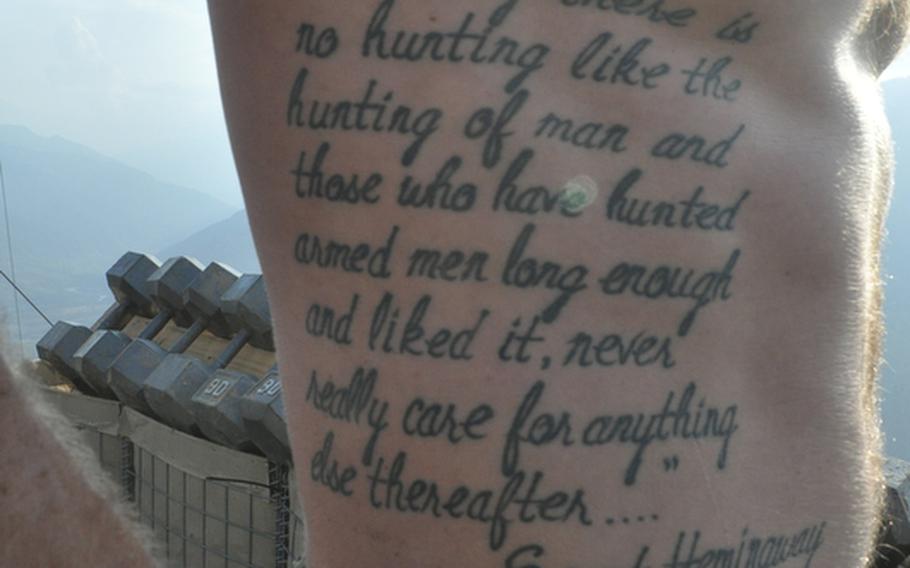 Sgt. Christopher Mitchell has a quote from Ernest Hemingway tattooed on his torso: "Certainly there is no hunting like the hunting of man and those who have hunted armed men long enough and liked it, never really care for anything else thereafter..."