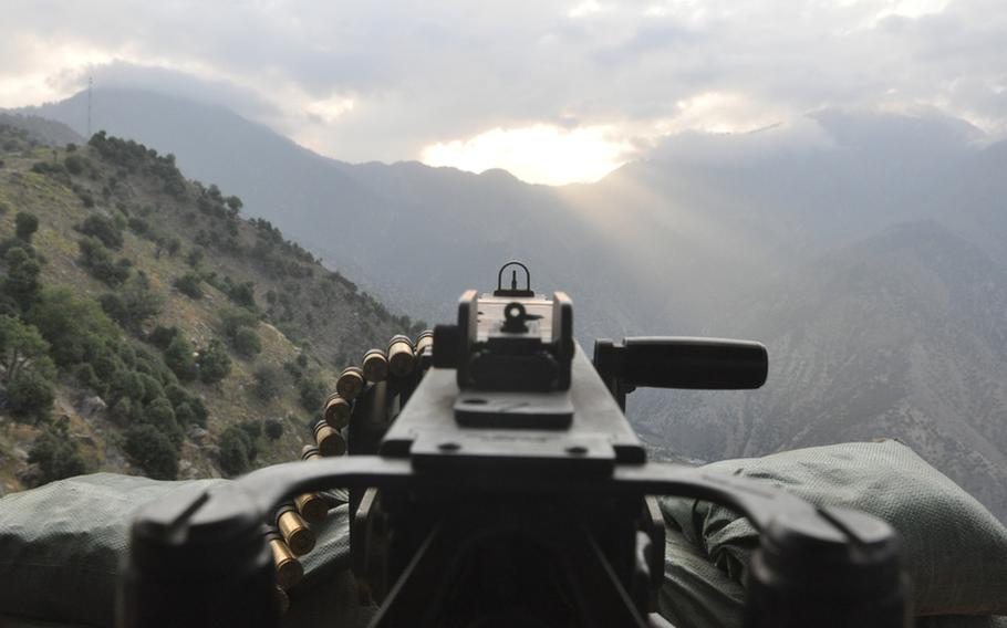 Gunrise: The sun comes up over the Hindu Kush mountains along the Afghanistan-Pakistan border, less than 10 miles from Observation Point Mustang in eastern Kunar province.