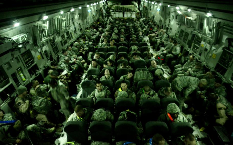 The last U.S. airmen to leave Iraq as well as some of the last U.S. soldiers to leave Iraq begin their journey home onboard a C-17 Globemaster heading for Kuwait.
