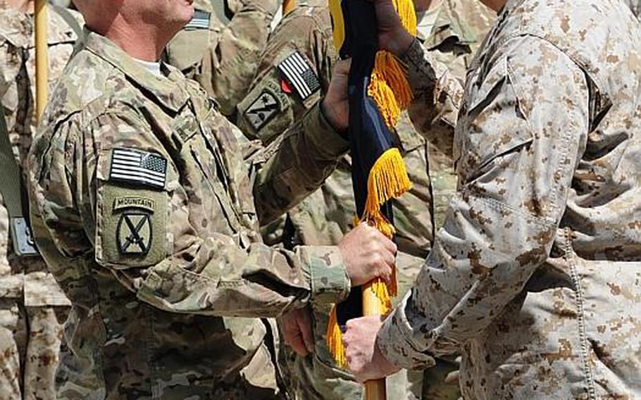 Marine Corps Gen. John R. Allen, right, International Security Assistance Force and United States Forces-Afghanistan Commander, transfers the colors to Army Maj. Gen. Kenneth R. Dahl, incoming USFOR-A Deputy Commander-Support and U.S. National Support Element Command-Afghanistan Commander during a ceremony July 3 at the New Kabul Compound. Dahl replaces Army Maj. Gen. William E. Rapp.