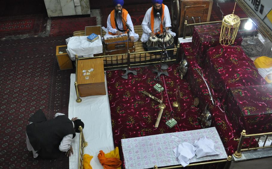 A worshiper bows in prayer at a Sikh temple in Kabul. The Sikh and Hindu community has been in Afghanistan for centuries but harassment, poverty and violence have pushed most of its members to leave Afghanistan.