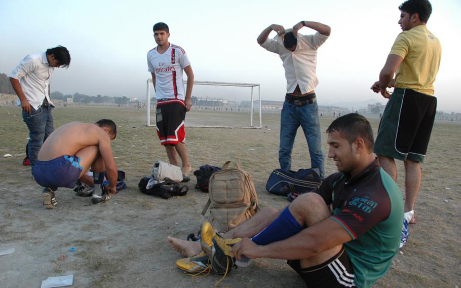 Players from Kabul United Rugby Club prepare for practice at Chaman-i-Huzuri park on Sunday.