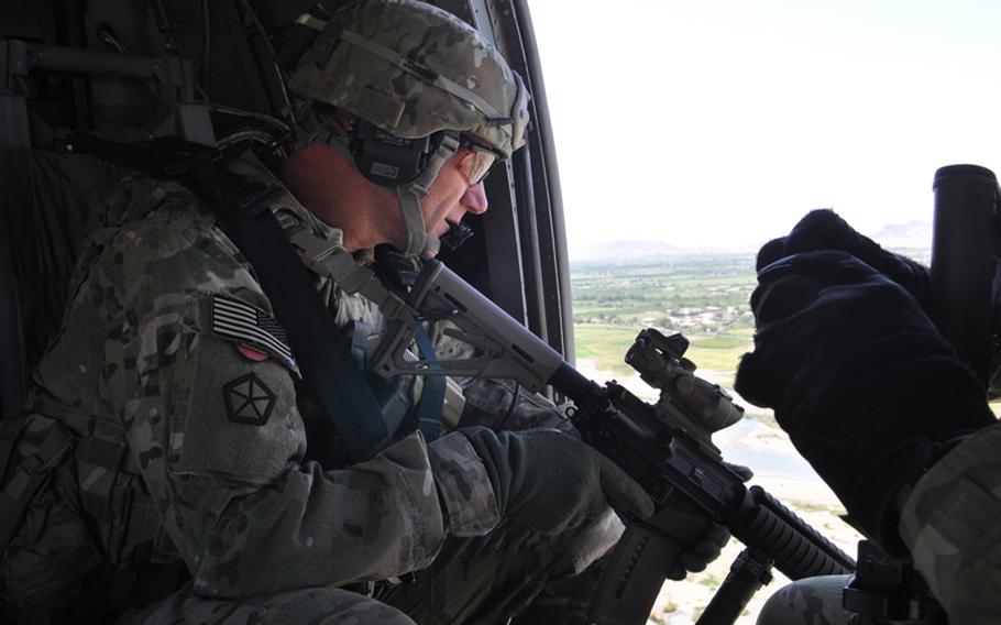 Command Sgt. Maj. Bill Johnson on a Blackhawk helicopter during a battlefield circulation Sept. 27, 2012, in southern Afghanistan. Johnson, the top enlisted man for ground forces in Afghanistan, said he is working with his soldiers and Afghan counterparts to combat the rising trend of Afghan troops turning their weapons on their international allies.