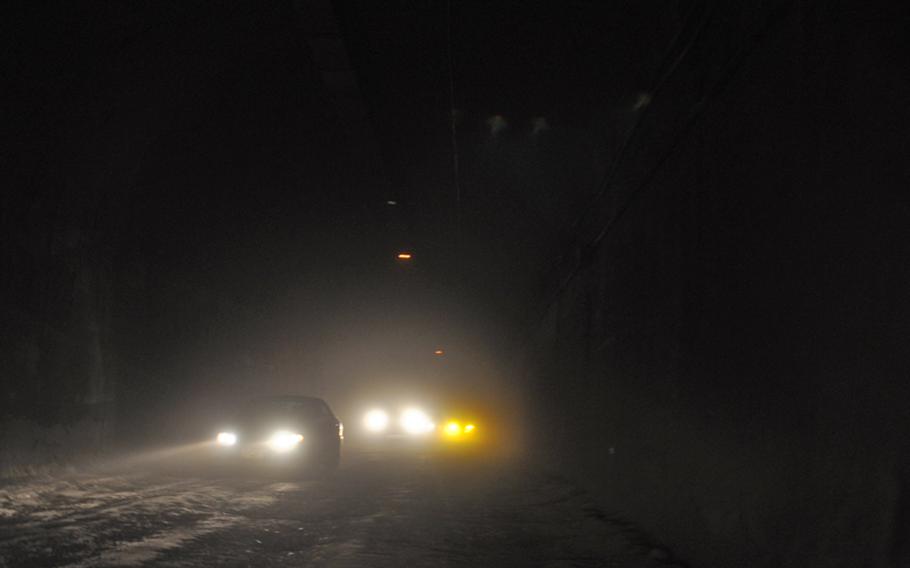 Traffic in the strategically important Salang Tunnel, where a poor ventilation system and failing lights installed by the Soviets create a soup of exhaust and dust that in some places reduces visibility to near zero and causes many accidents. The U.S. Army Corps of Engineers recently awarded a $12.8 million contract to an Afghan company to improve the crumbling tunnel, which has been the scene of many fatal accidents.