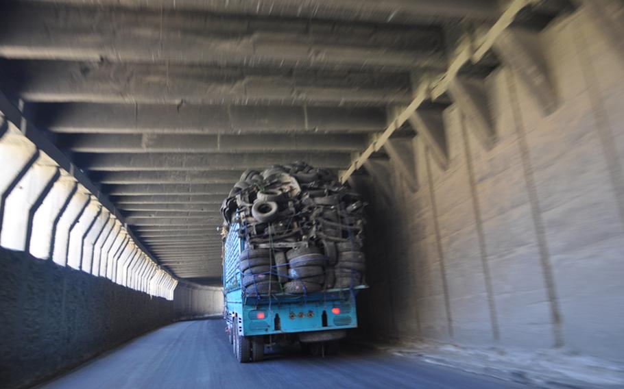 A truck makes its way through one of the many galleries on the winding road to the Salang Tunnel north of Kabul. The galleries, like the tunnel, had fallen into disrepair in recent years and are being improved as part of a $12.8 million construction project recently awarded by the U.S. Army Corps of Engineers.
