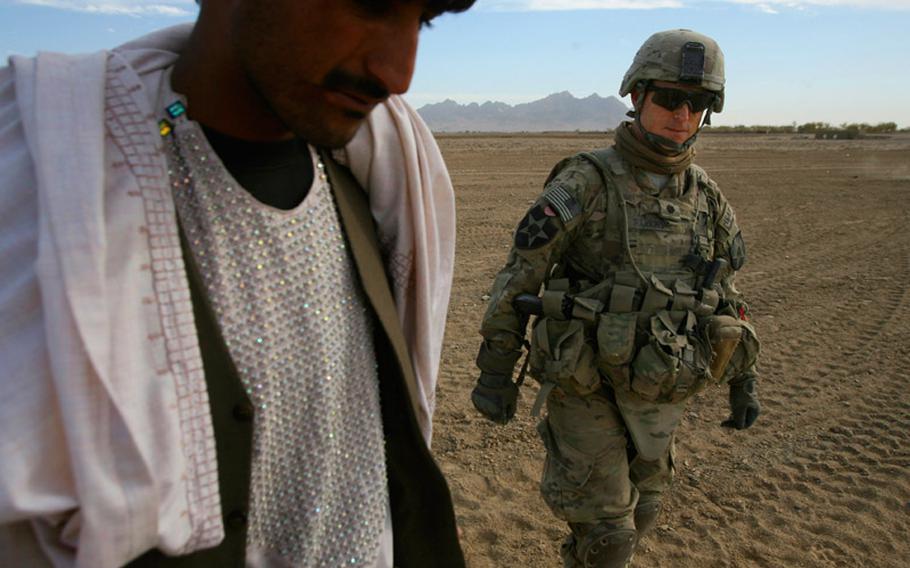 Lt. Col. Greg Harkins, commander of 4th Battalion, 23rd Infantry Regiment, walks near the "Road of Martyrs" on November 26, 2012 in northwestern Kandahar province, Afghanistan.