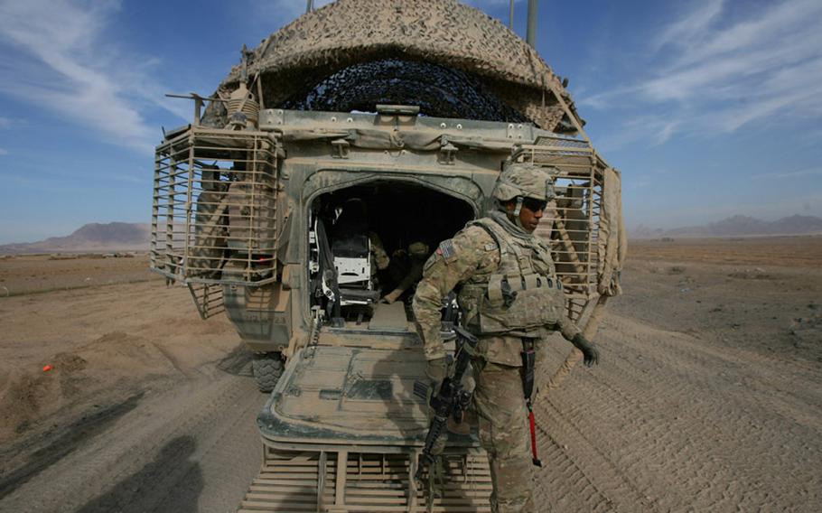 Capt. Aaron Thurman, with 4th Battalion, 23rd Infantry Regiment, steps out of a Stryker vehicle Nov. 26 on the "Road of Martyrs" in northwestern Kandahar province, Afghanistan.
