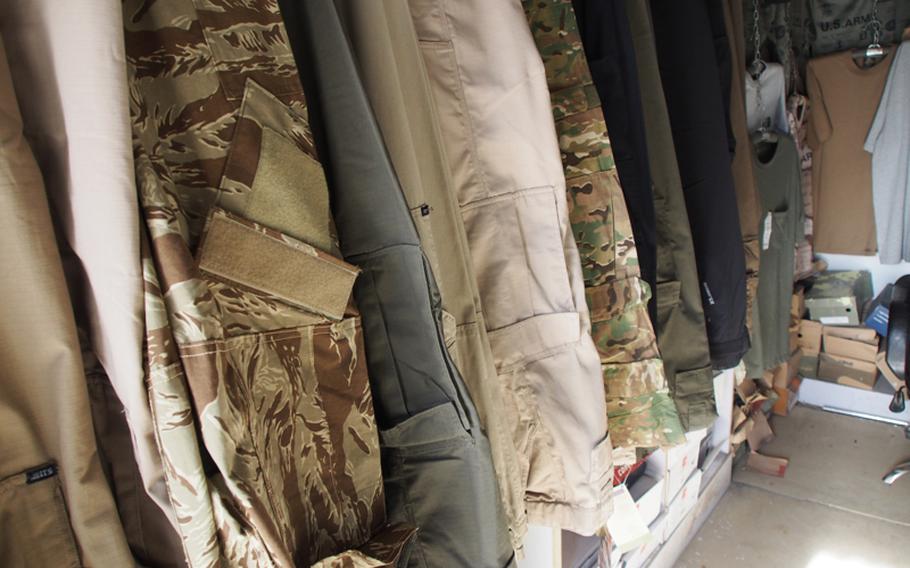 U.S. military uniforms are for sale at a Kabul market. Though illegal to sell, the uniforms are easy to find and Taliban fighters have dressed as U.S. soldiers in two major attacks in the past four months, including one in which they destroyed or damaged eight fighter jets at a major U.S. base.