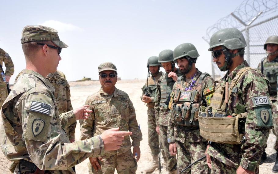 First Lt. Preston Gentry, with the 162nd Explosive Ordnance Disposal Company, 3rd Ordnance Battalion at Forward Operating Base Apache, Afghanistan, debriefs Afghan National Army soldiers based at FOB Eagle. During training, the Afghan soldiers successfully disarmed a simulated bomb. Gentry is preparing Afghan National Army to take control of explosive ordnance disposal missions in Zabul province from coalition troops who are leaving Afghanistan in 2014.