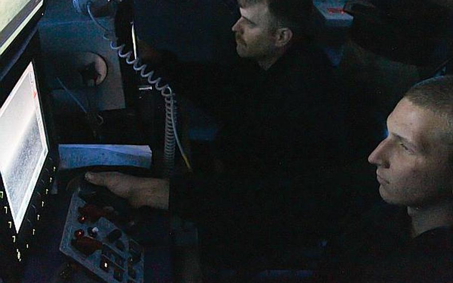 Seaman Ethan Curtis keeps an eye on surface contacts near the USS Ponce. Earlier in the day sailors in the combat direction center paid close attention to an Iranian navy vessel that came near the ship Tuesday. The USS Ponce is currently participating an international mine countermeasures exercise.