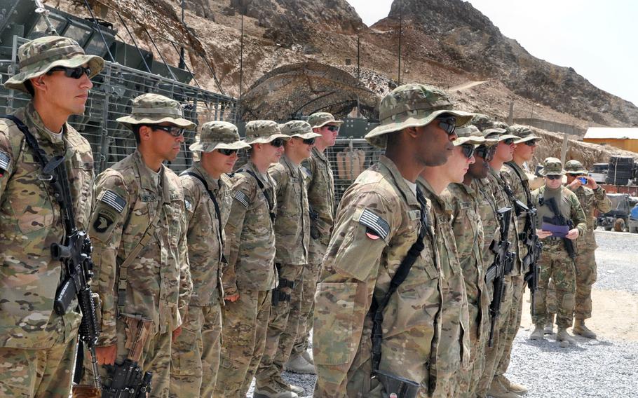 Members of Company A, 1st Squadron, 2nd Cavalry Regiment line up for a promotion ceremony at Forward Operating Base Masum Ghar. The unit's leaders are still trying to learn their way around complex local politics in Panjwai district in Kandahar province.