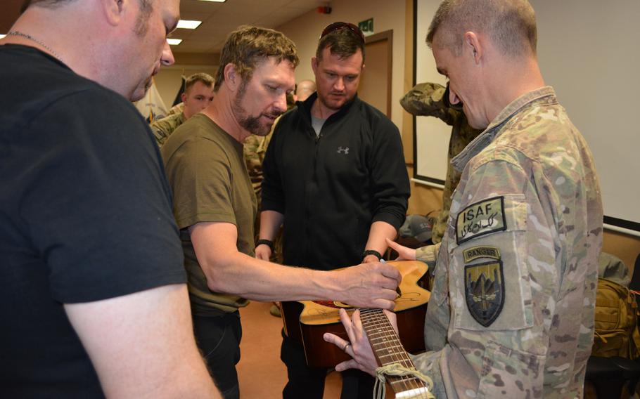 Country singer Craig Morgan visited with troops from the XVIII Airborne Corps in Kabul and played several songs for them on Tuesday, May 6, 2014. Morgan, who served in the U.S. Army for 19 years, is on a tour to perform for deployed servicemembers. Morgan autographed a guitar belonging to one of the soldiers that he used to play for the troops.