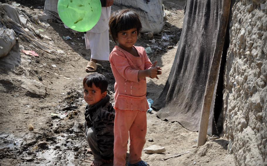 Children play in a camp in Kabul set aside for refugees who returned from other countries. Despite returning to their home country, many refugees nonetheless found themselves stuck in such camps for more than a decade.