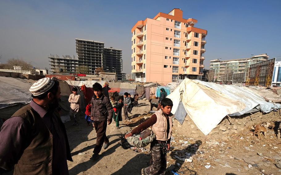 Camps for internally displaced such as this one in Kabul in December 2014 are being cleared to make way for new high-rise buildings. The refugees who have occupied the camps for more than a decade have mixed feelings about moving. Some hope for better shelter, while mourning the jobs they will lose by leaving.