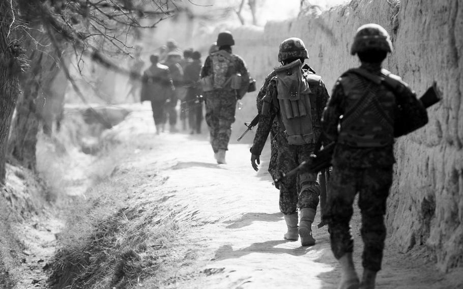 Afghan security forces patrol a village in Panjwai district, once known as part of the 'Birthplace of the Taliban.' Despite its bloody history, Panjwai and surrounding districts have become something of a bright spot with residents increasingly supporting the central government.