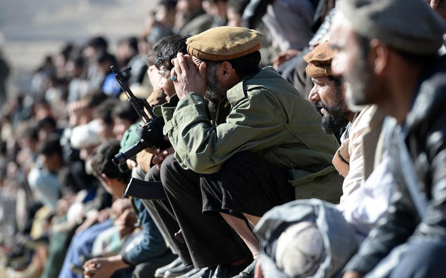 Crowds watch a buzkashi match on the outskirts of Kabul on Jan. 15, 2015. The games are usually attended exclusively by men.