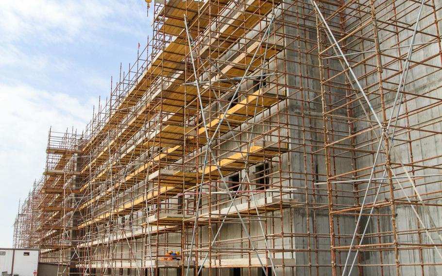 A barracks building under construction at Naval Support Activity Bahrain will have 241 units to house 482servicemembers. Officials expect the $45.5 million building to be completed in December.