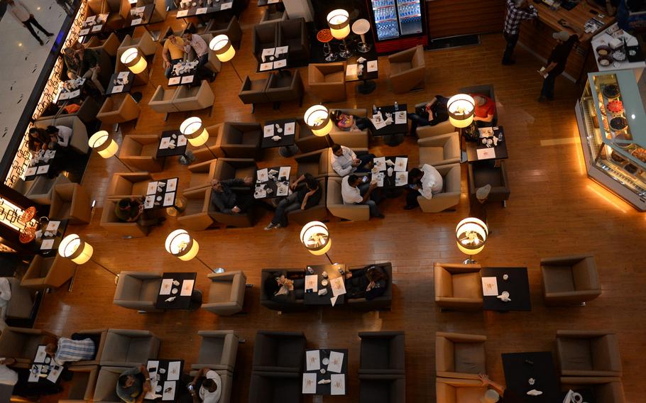 Diners sit at a cafe inside Mansour Mall in Baghdad. A $25-million Iraqi-Turkish project, the mall opened in 2013 and has become a popular haven for Baghdad's upper middle class.