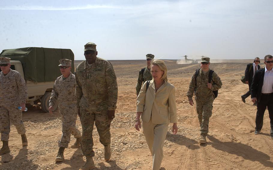U.S. Army Gen. Lloyd Austin, left, and U.S. ambassador to Jordan Alice Wells arrive at a demonstration of military firepower at the Wadi Shadiya training range in Jordan on Monday, May, 18, 2015. The event, which included a B-52 bombing, was the culminating act of the multinational exercise Eager Lion.