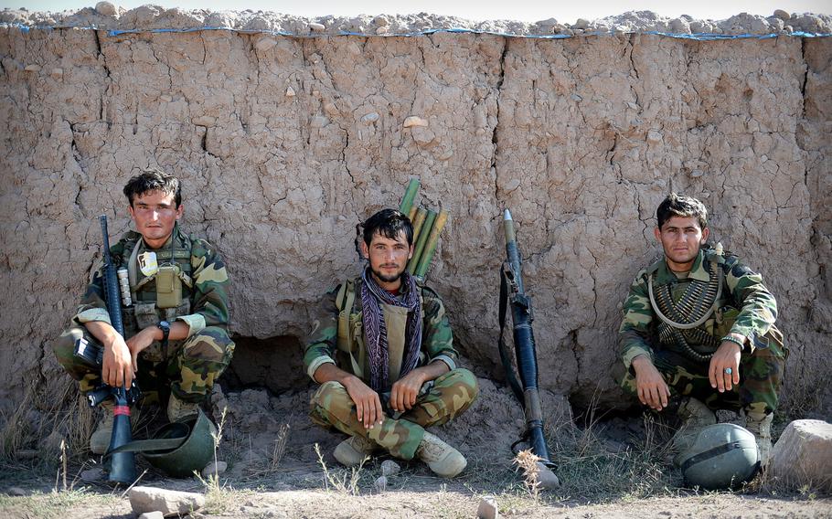 Afghan National Army soldiers rest before an operation in Nangarhar province in August 2015. Between high rates of desertion and casualties, Afghan security forces are losing as many as 4,000 members per month, according to U.S. officials.