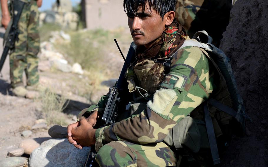 An Afghan National Army soldier rests before an assault on a Taliban compound in Nangarhar province in August 2015. Losses among Afghan security forces have increased as the insurgency continues.