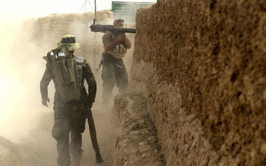 Afghan troops fire rockets at Taliban positions during the battle to clear militants from Kunduz city. The Taliban capture of Kunduz and the struggle to retake the city has called into question the capabilities of the NATO-trained government forces.