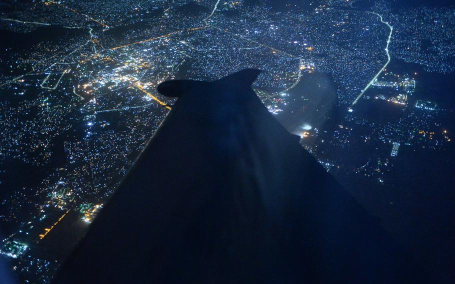 The city lights of Kabul glow in the distance during a Sept. 1, 2015, aerial surveillance mission by Afghan Special Mission Wing.