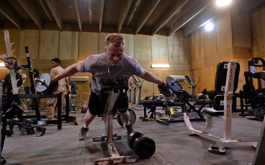 U.S. Army Spc. Ryan Bussell works out at the gym at the coalition base in Besmaya, Iraq, on April 26, 2015. Like many structures at the base, the building used as a gym and recreation center dates from the last U.S. presence here before 2011.